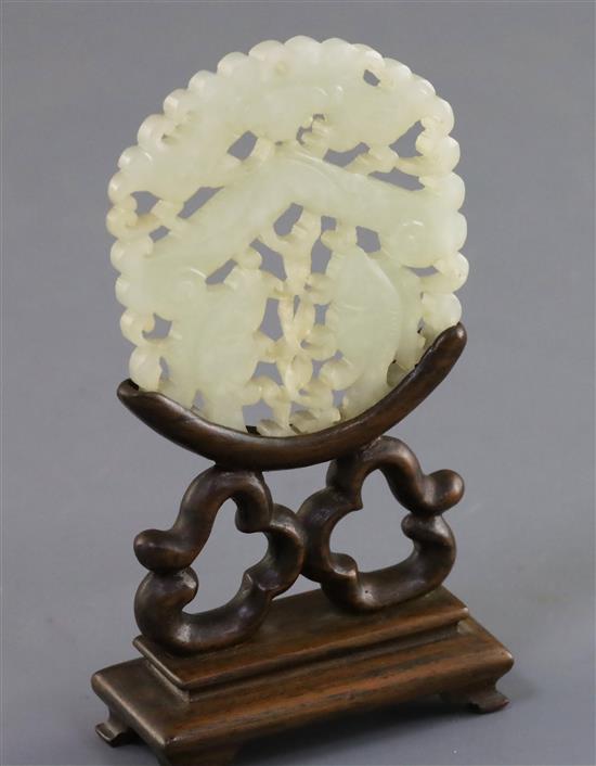 A Chinese pale celadon jade fish plaque, 19th century 6cm, wood stand